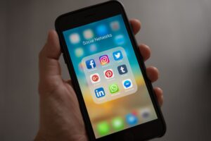 Social media icons with mobile phone